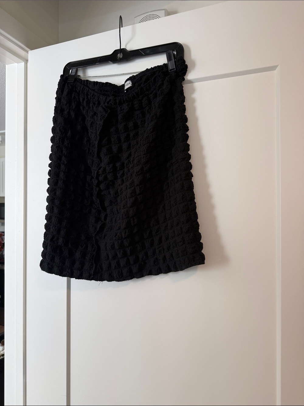 Black perforated mini skirt